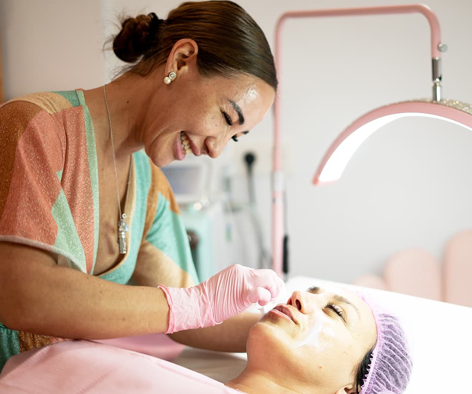 Beauty clinician performing a treatment on a client